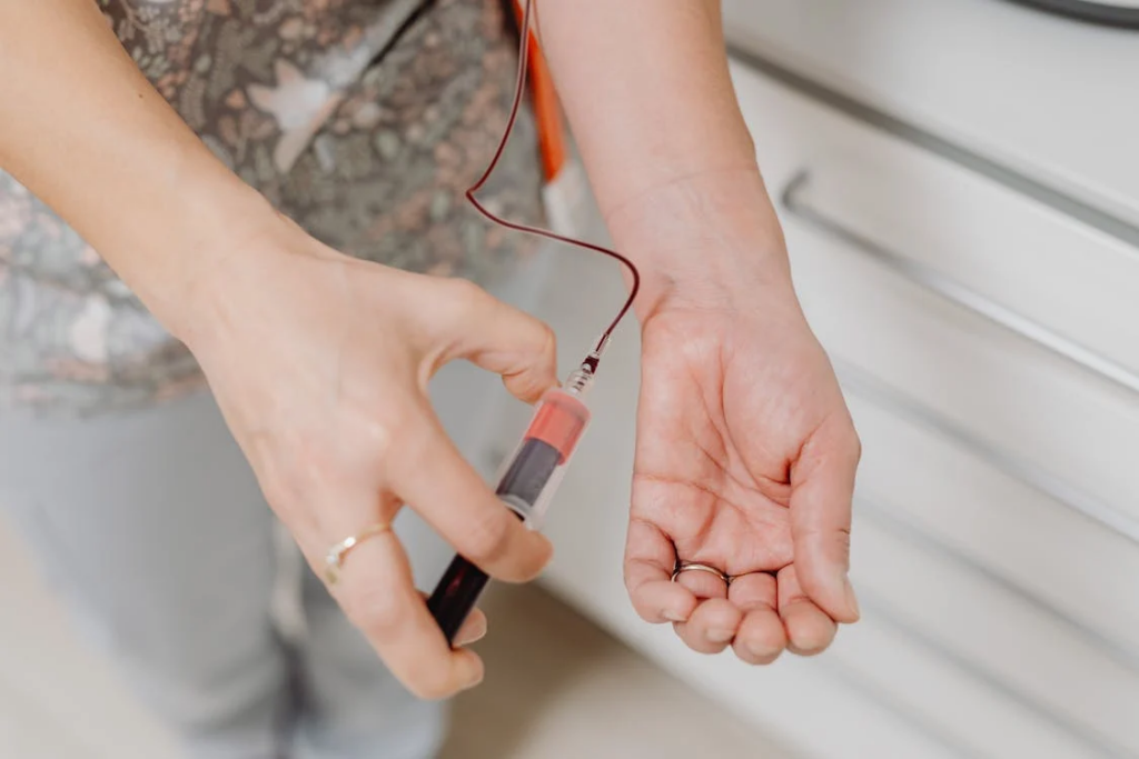 A Nurse Drawing Her Own Blood