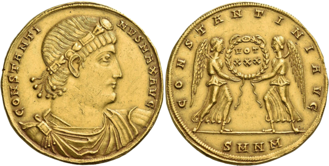 Gold coin from Emperor Constantine's era (4th century CE). The obverse shows Constantine's profile with his name inscribed, while the reverse depicts two winged figures (angels) holding a wreath with the Latin inscription 'CONSTANTINUS'. This coin represents the period when Christianity became officially recognized and the first Church of the Holy Sepulchre was built.