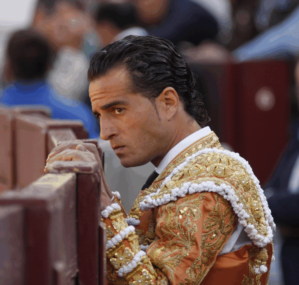 Side profile of Iván Fandiño staring into the ring in uniform. 