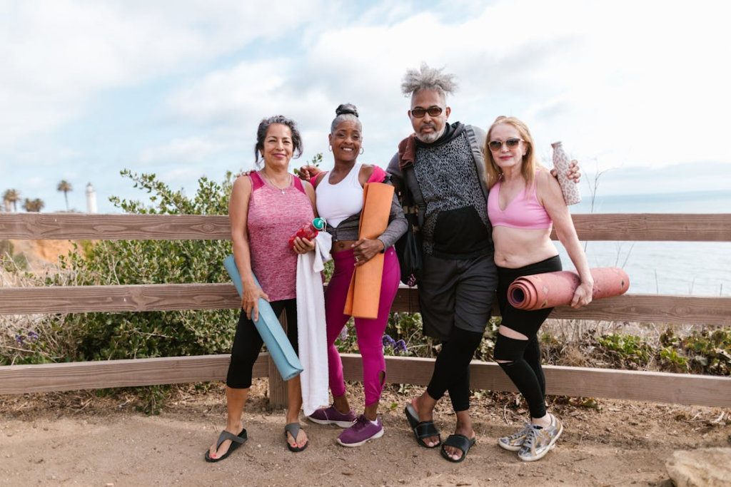People Standing Beside A Wooden Fence