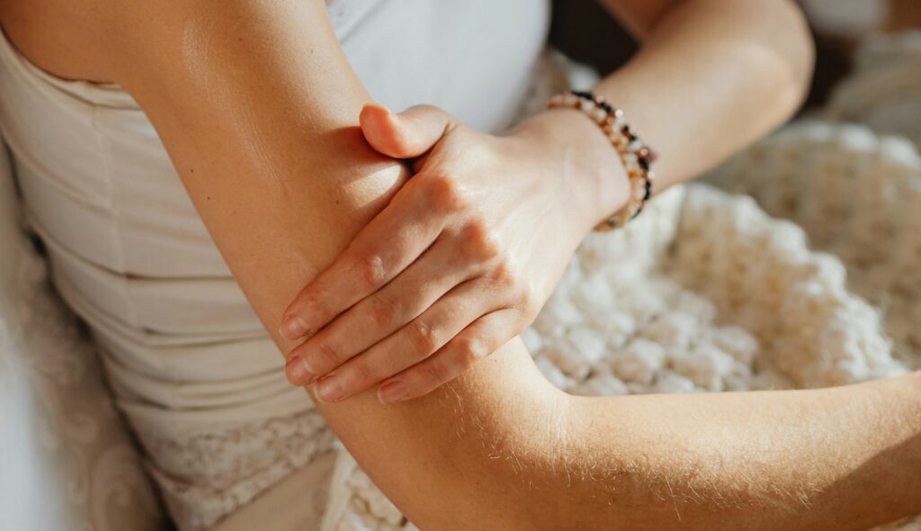 woman touching arm checking for ignored cancer symptoms