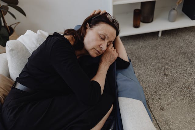 woman sleeping on couch