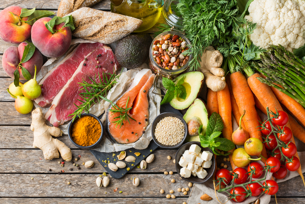 Balanced nutrition concept for clean eating flexitarian mediterranean diet. Assortment of healthy food ingredients for cooking on a kitchen table. Top view flat lay background