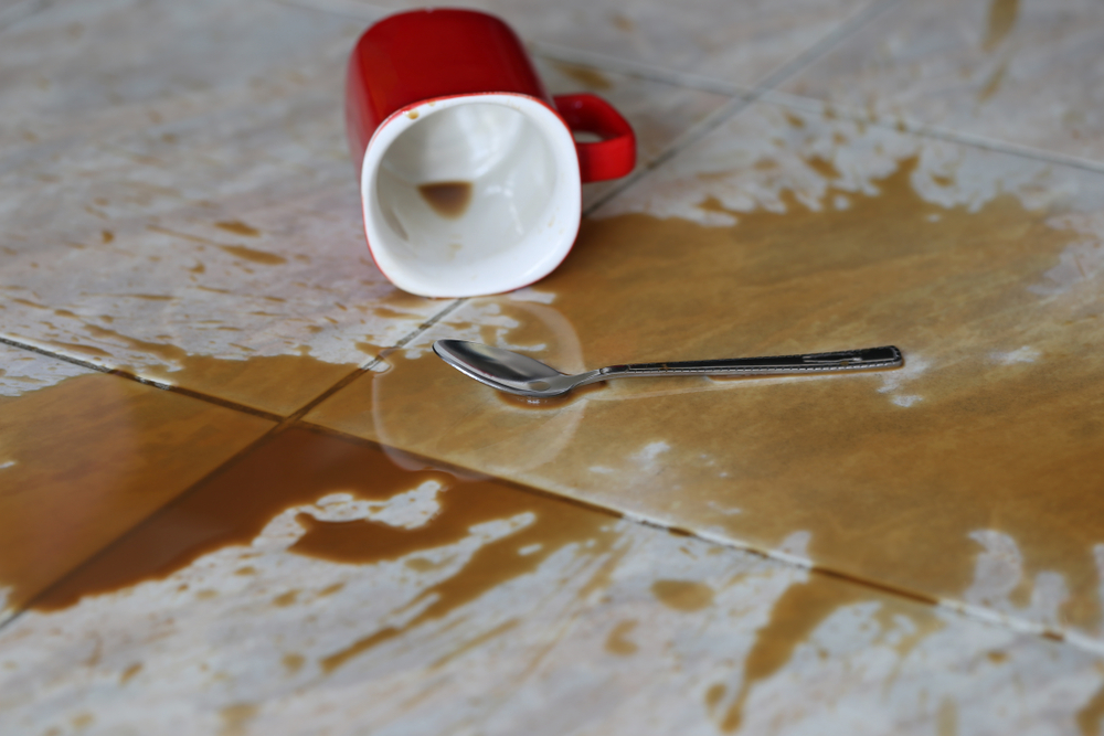 Coffee spilled stain accident on the floor 