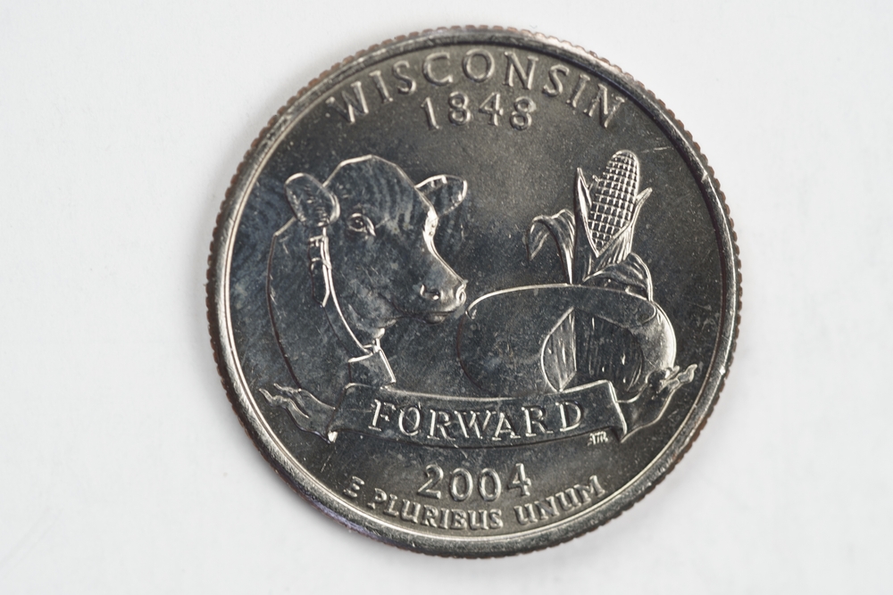 A quarter dollar (25 cents) coin with the image of Wisconsin (the Badger State), USA.