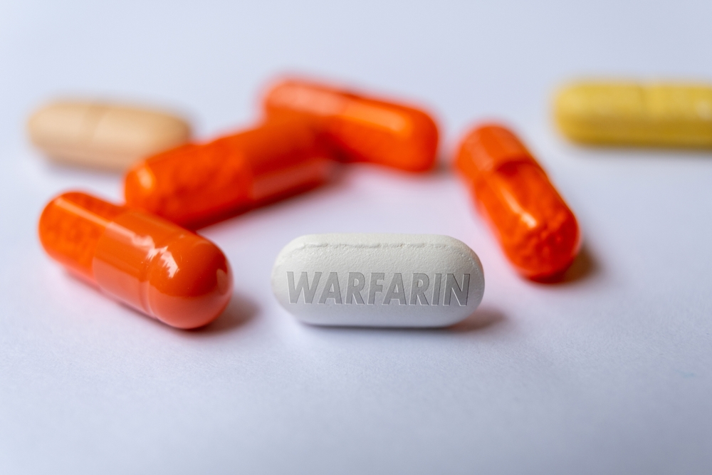 Warfarin pill drug, used as an anticoagulant to treat blood clot