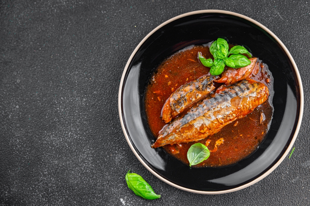 mackerel tomato sauce canned fish seafood eating cooking appetizer meal food snack on the table copy space food background rustic top view
