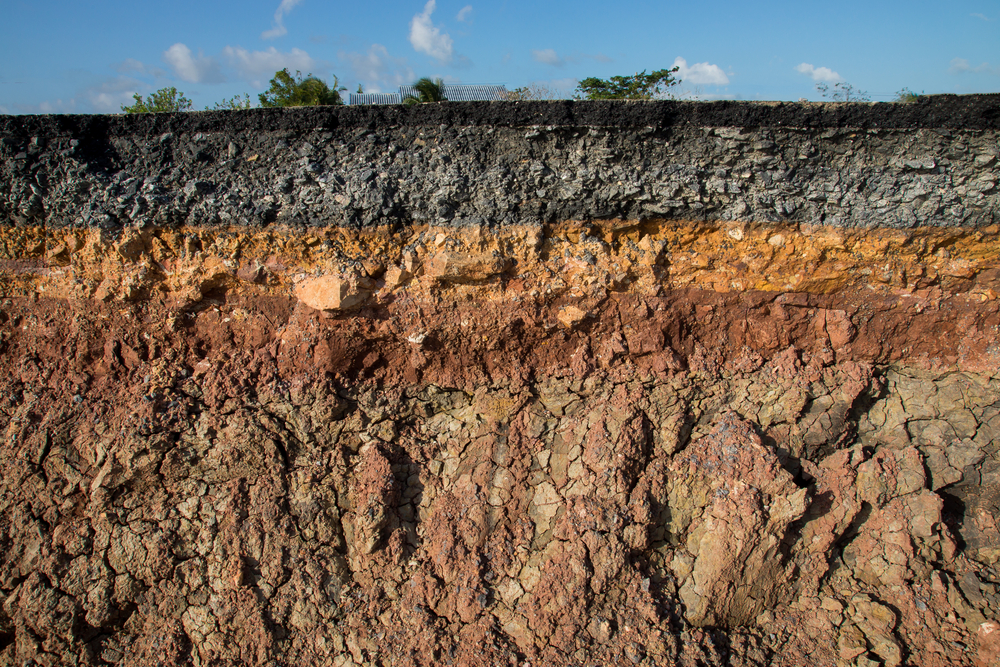 The curb erosion from storms. To indicate the layers of soil and rock.
