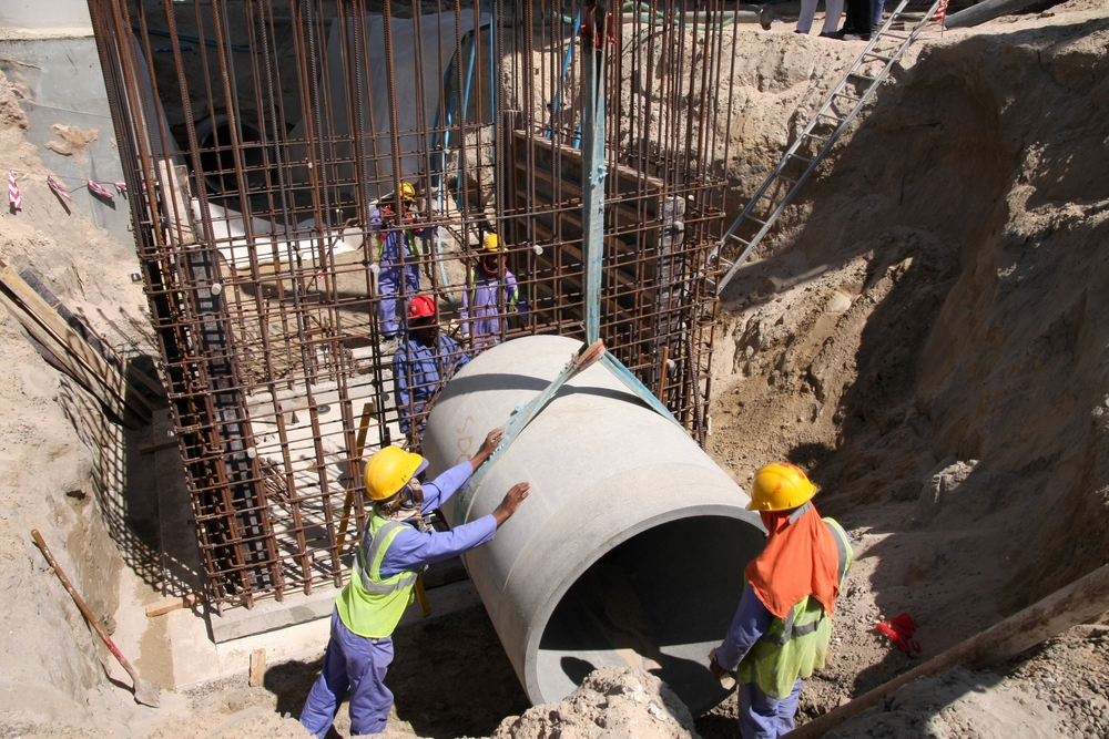 Dubai, UAE - Oct 16, 2024: Workers at a construction site in Dubai. There are a large number of migrants working in the construction industry in UAE
