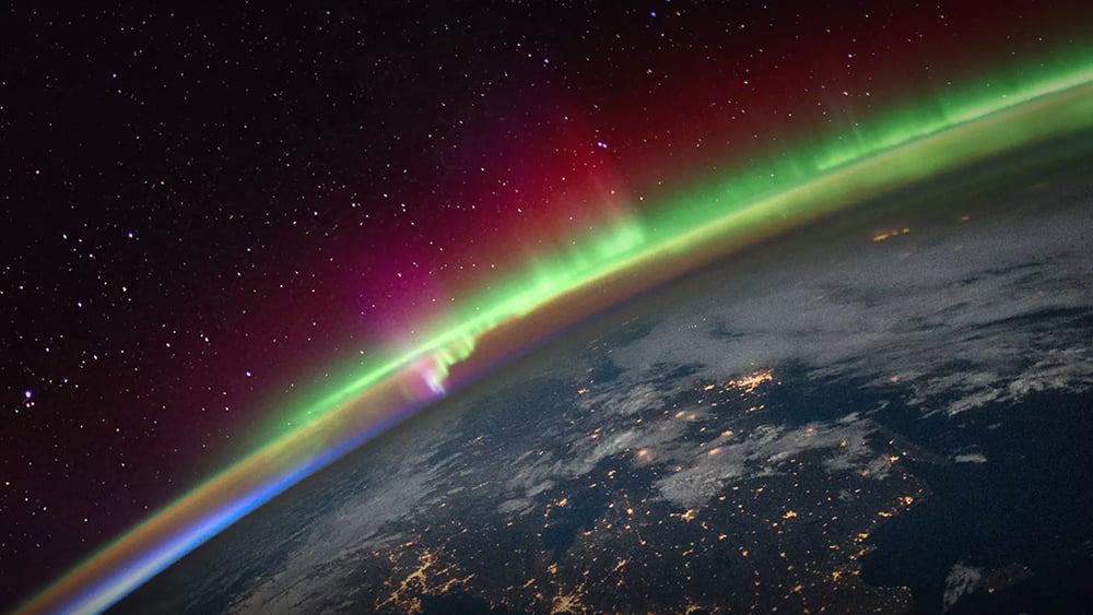 Spectacular aurora display visible from orbit demonstrating the visual effects of geomagnetic storm activity on Earth's atmosphere.