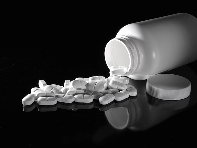 supplements pouring out of a bottle