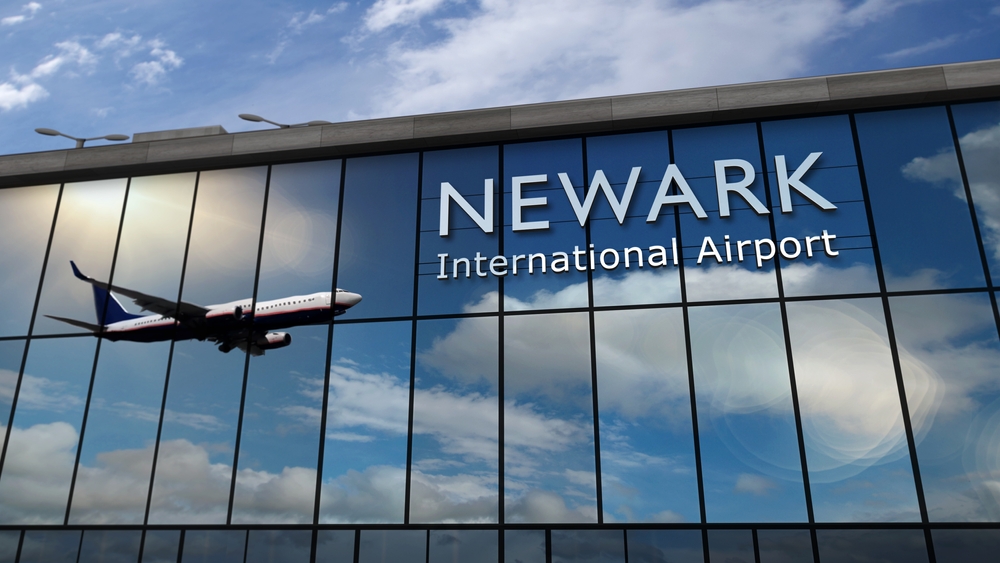 Aircraft landing at Newark, New Jersey, USA 3D rendering illustration. Arrival in the city with the glass airport terminal and reflection of jet plane. Travel, business, tourism and transport.