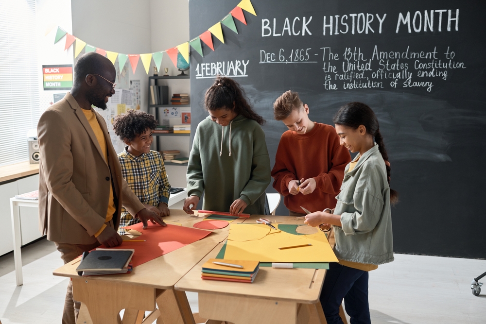 Children with teacher preparing for Black History Month
