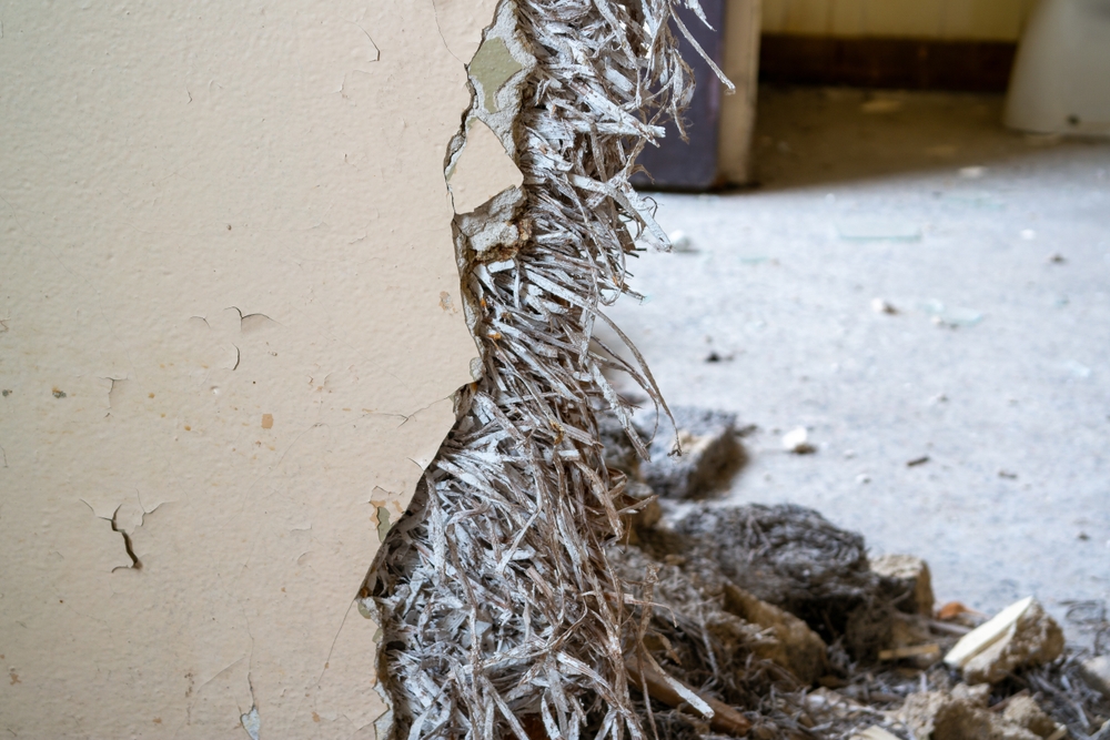 Old asbestos in a wall in the room, harmful to health