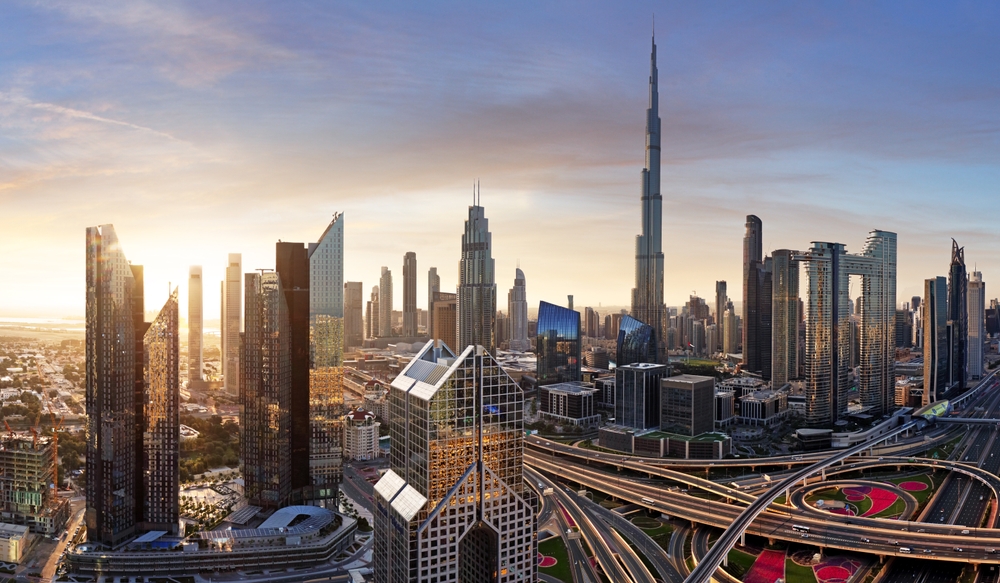 Dubai skyline at sunset with traffic - aerial view, United Arab Emirates