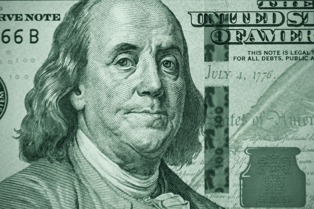Close-up of part of a hundred dollar bill. Fragment of old 100 dollar bill