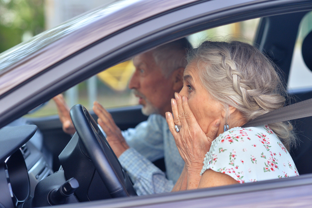 senior couple driving car