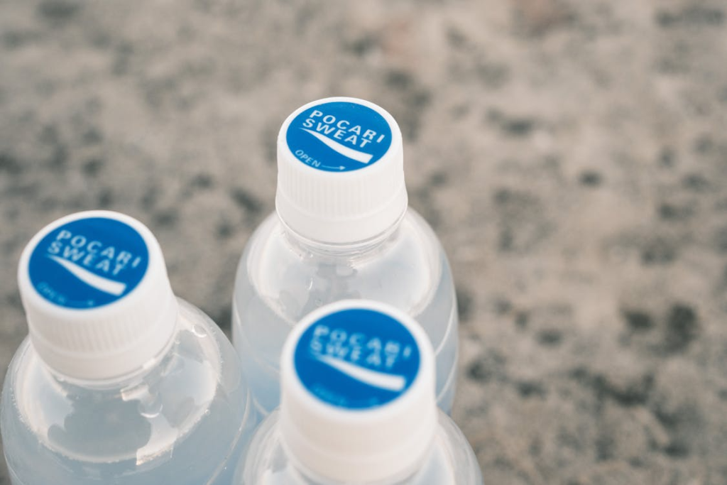 Close-up of Pocari Sweat Bottles on Stone Surface
