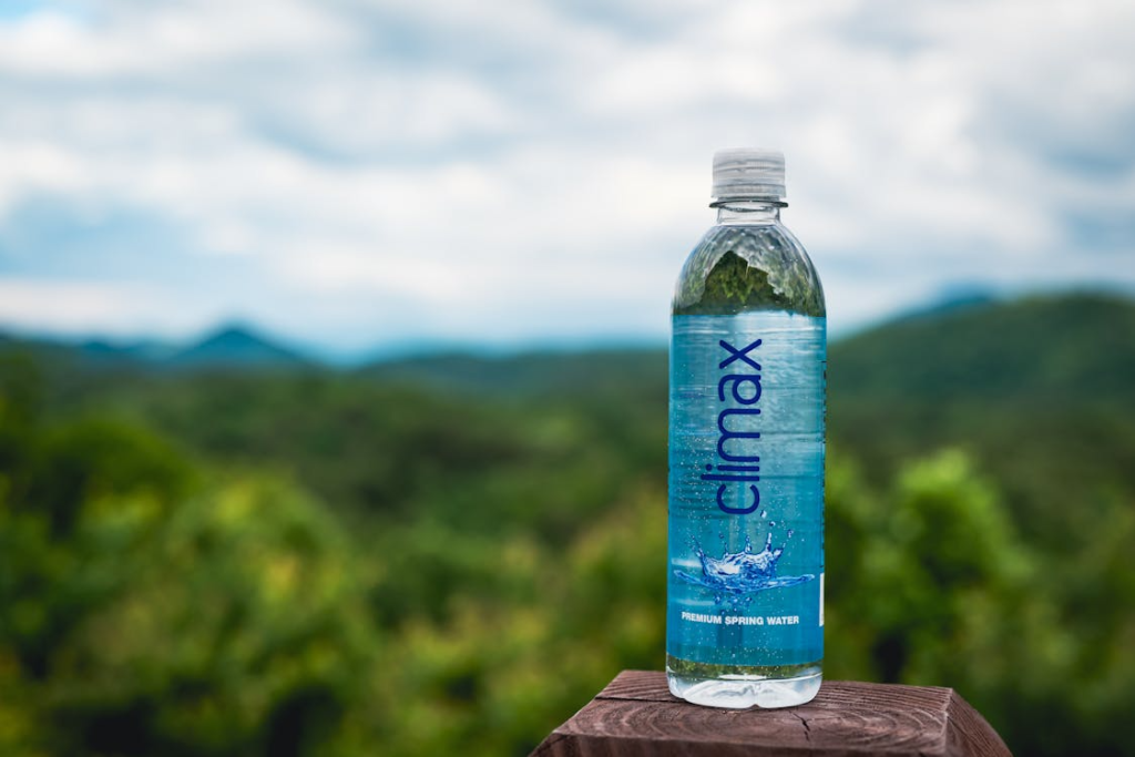 Plastic Bottle of Water on Wooden Surface
