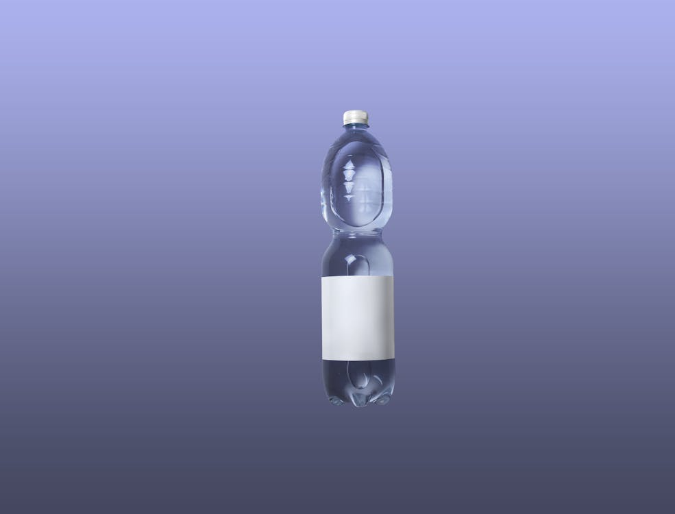Clear Plastic Bottle on Purple Background
