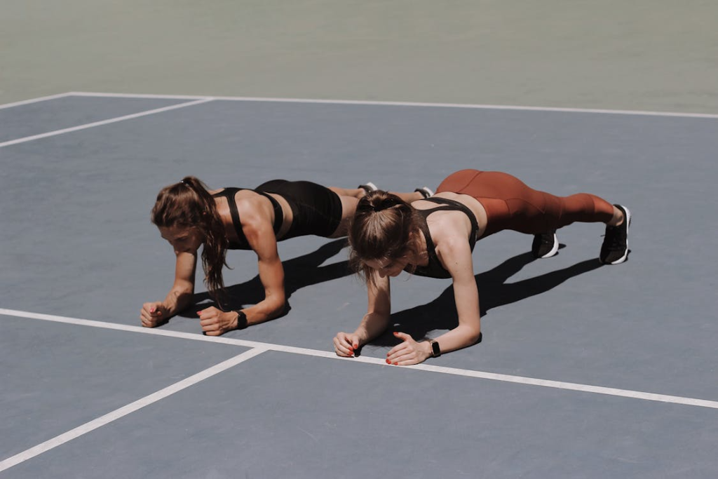 Two Women Doing Workout Together
