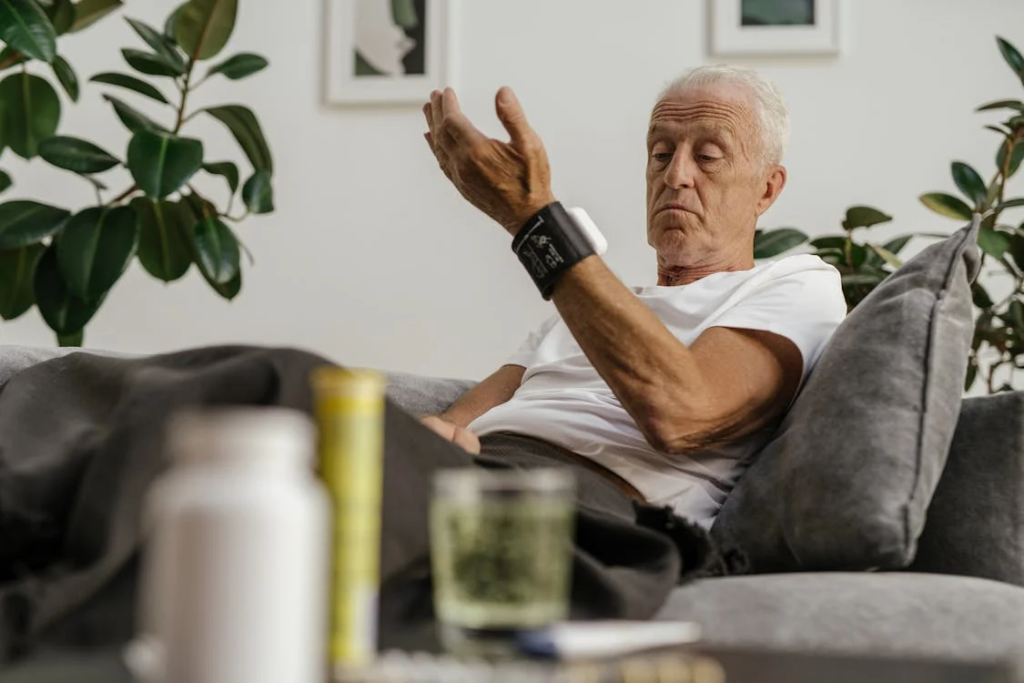 An Elderly Man Checking HIs Blood Pressure
