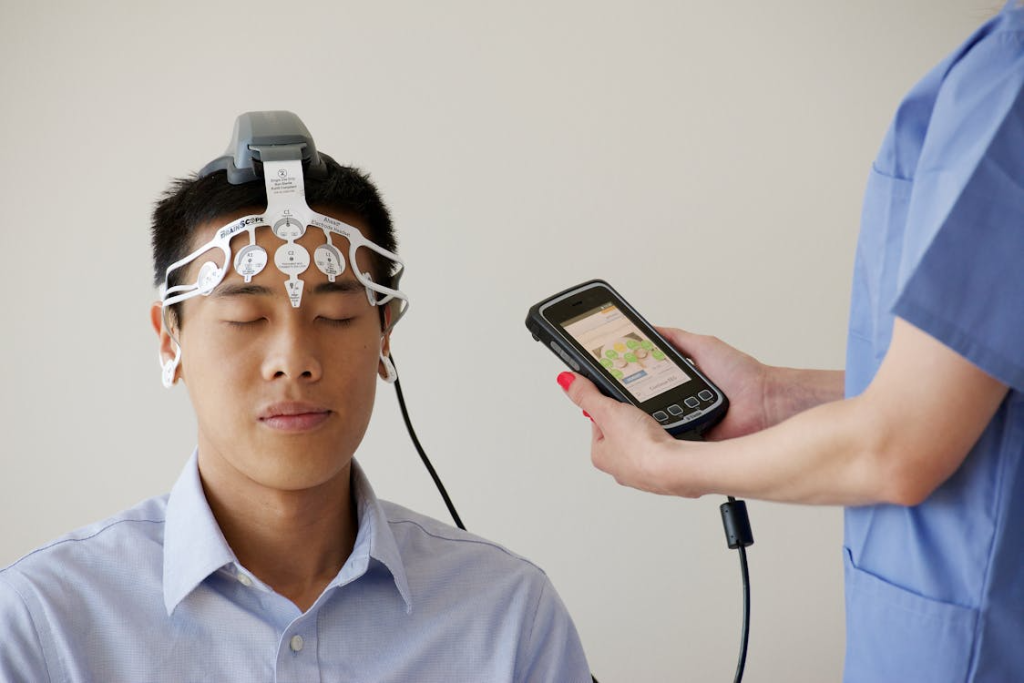 Man during Examination with Use of Brainscope
