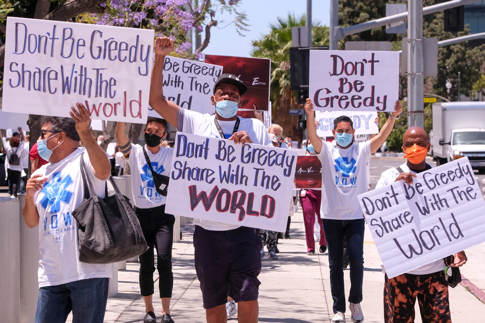 AIDS Healthcare Foundation advocates and their supporters take part in a demonstration to demand for the U.S. to make COVID-19 vaccines accessible across the globe, in Los Angeles, June 10, 2021.
