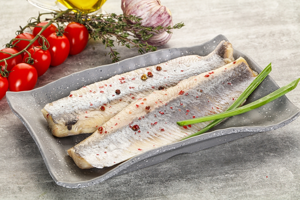 Marinated salted herring fillet with green onion