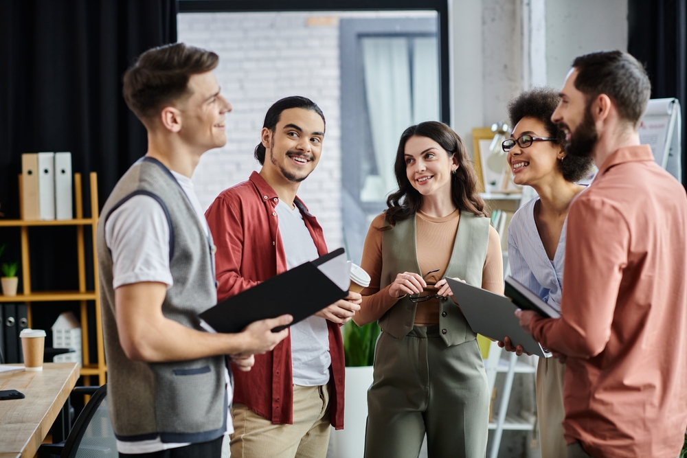 Team members engage in friendly conversation during a tough time.
