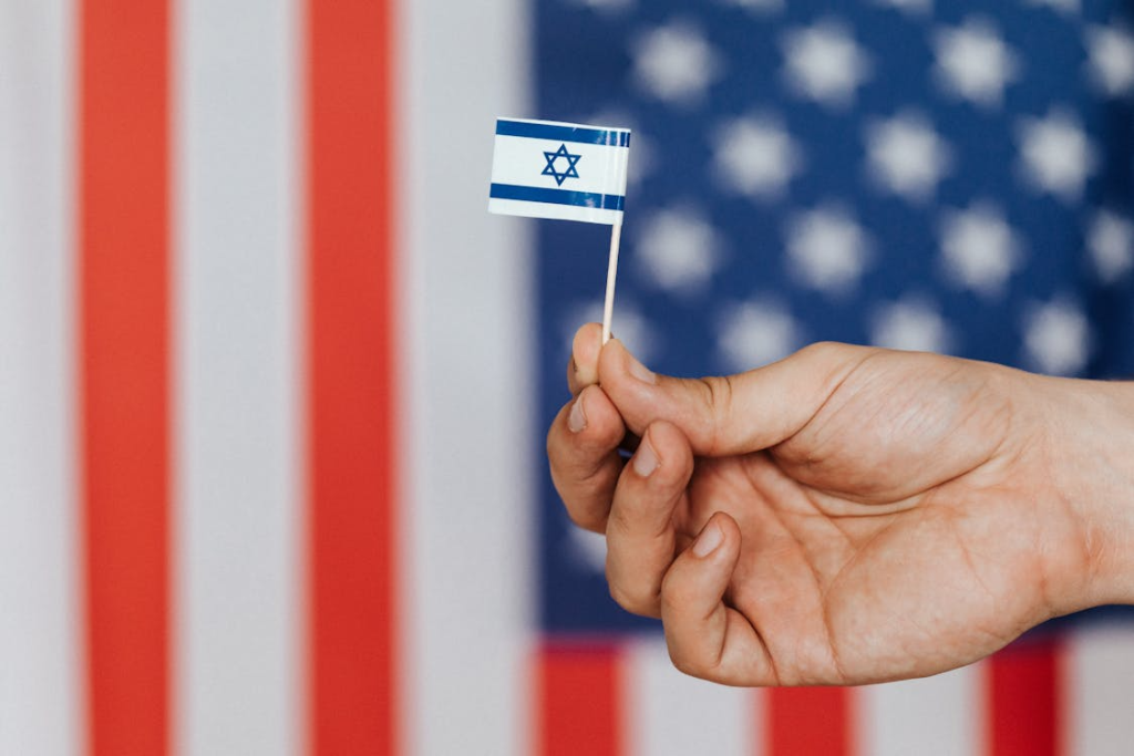 Crop person showing handmade flag of Israel

