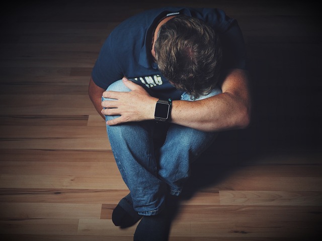 depressed man on floor