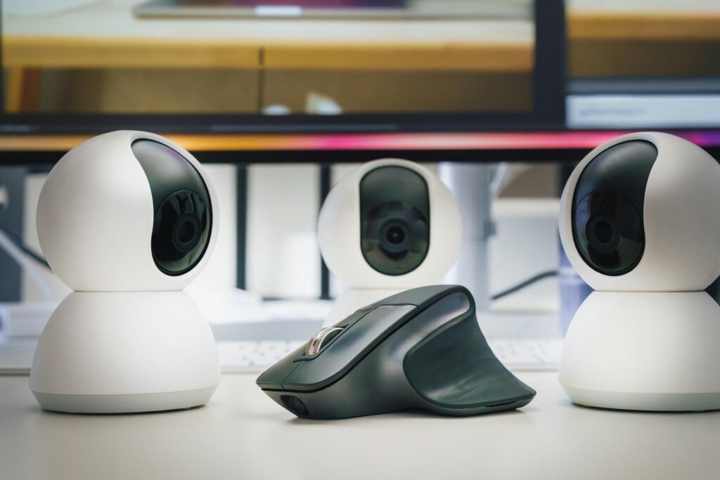 Surveillance web cameras observing computer mouse activity.
