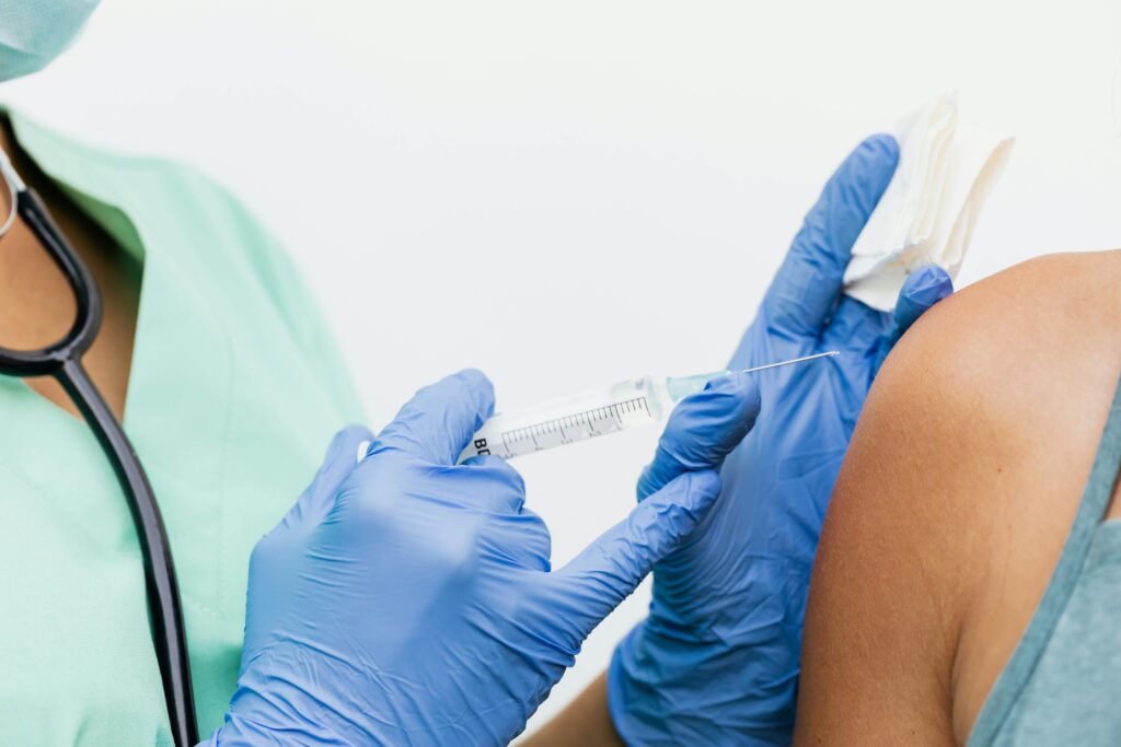 A Person Injecting Vaccine
