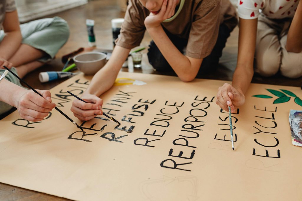 Students Painting on Brown Paper