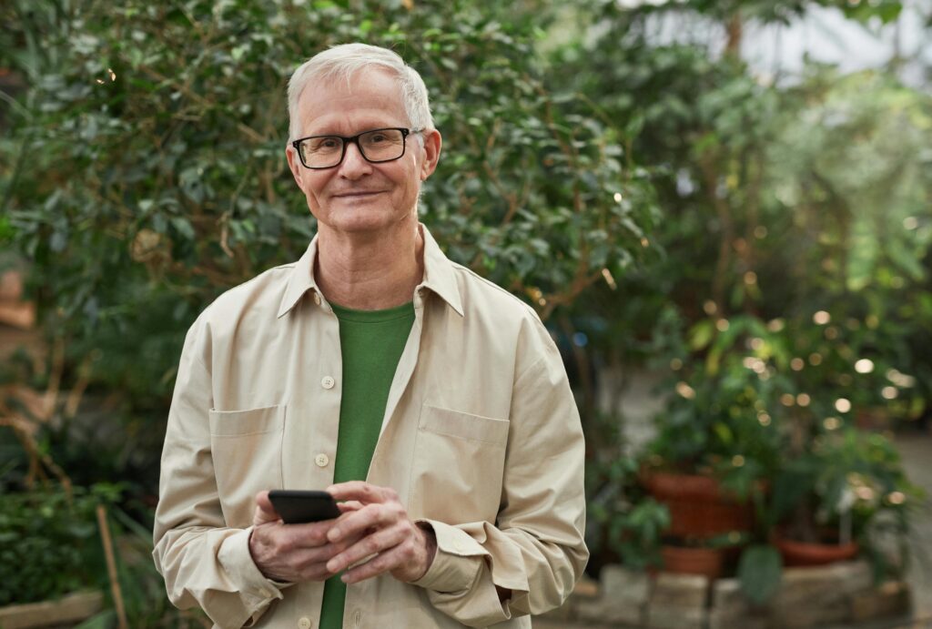 Smiling Man Wearing an Eyeglasses While Looking at the Camera
