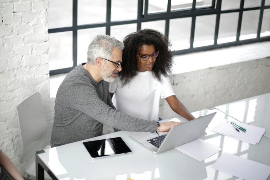 man and woman at desk