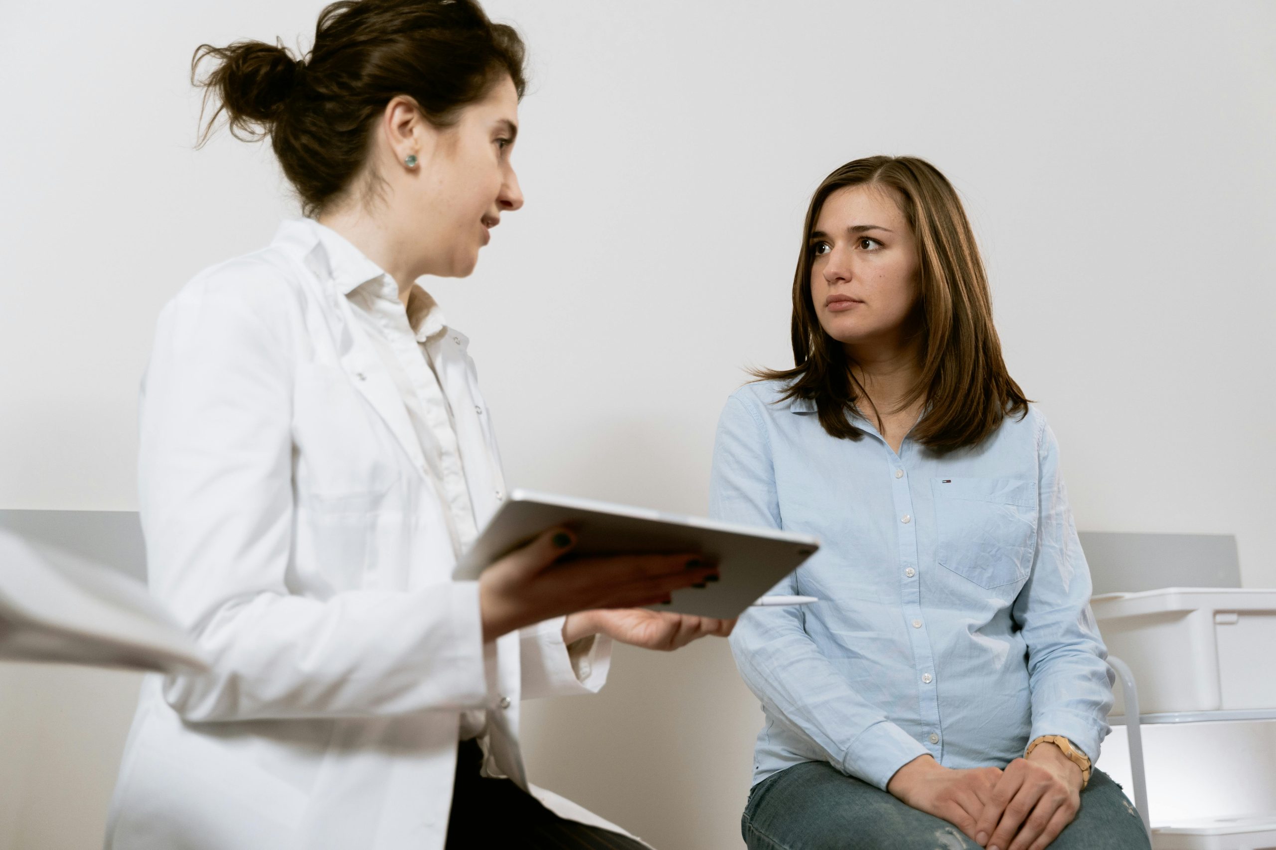 Physician reviewing treatment options with patient, emphasizing collaborative healthcare approach.