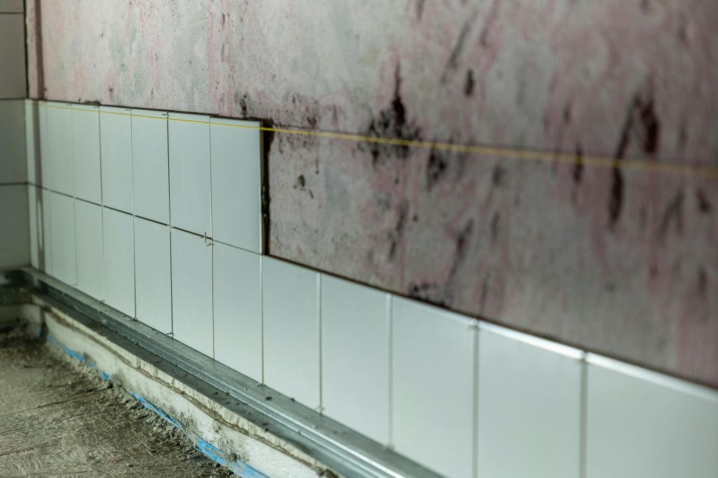 Unfinished Wall Tiling in Construction Site
