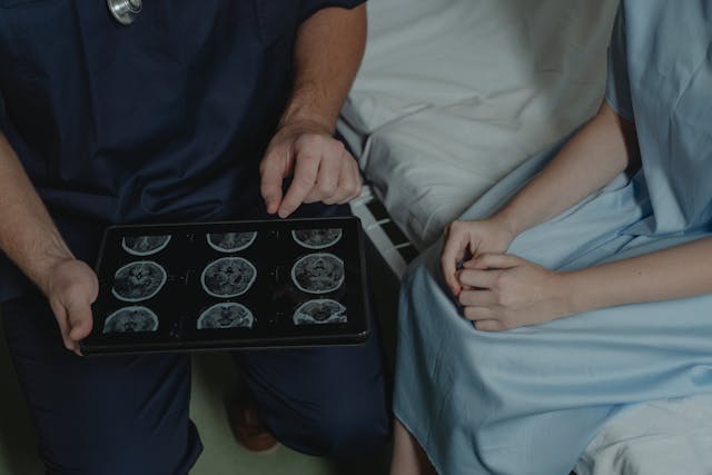 doctor showing scans to  patient