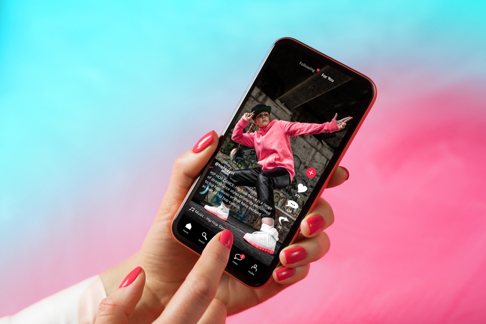 Sample social media app interface on mobile phone showing shared video content
