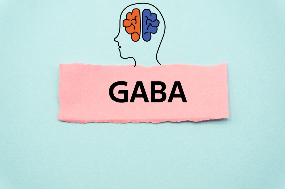 GABA.The word is written on a slip of colored paper. Psychological terms, psychologic words, Spiritual terminology. psychiatric research. Mental Health Buzzwords.
