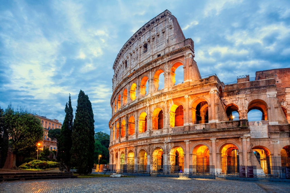 Colosseum morning in Rome, Italy. Exterior of the Rome Colosseum. Colosseum is one of the main attractions of Rome (Roma) and Italy. Architecture and landmark of Rome and Italy.