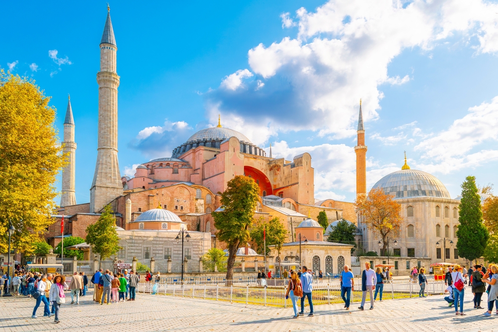 Istanbul, Turkey - September 10 2023: Visitors pass by the Hagia Sophia, an ancient church and mosque and now a museum, in the Sultanahmet Square area of Istanbul, Turkey.