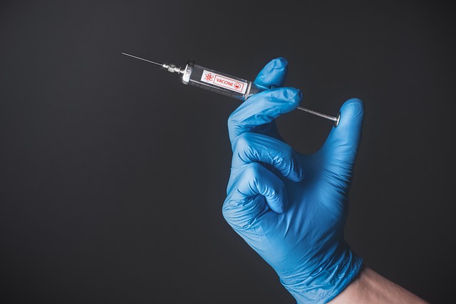 man holding syringe