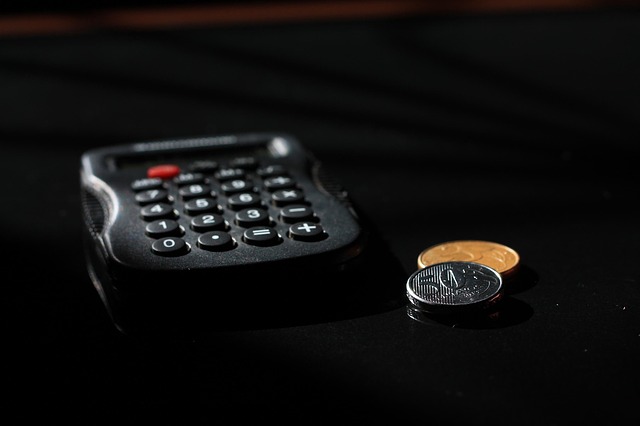 calculator and coins