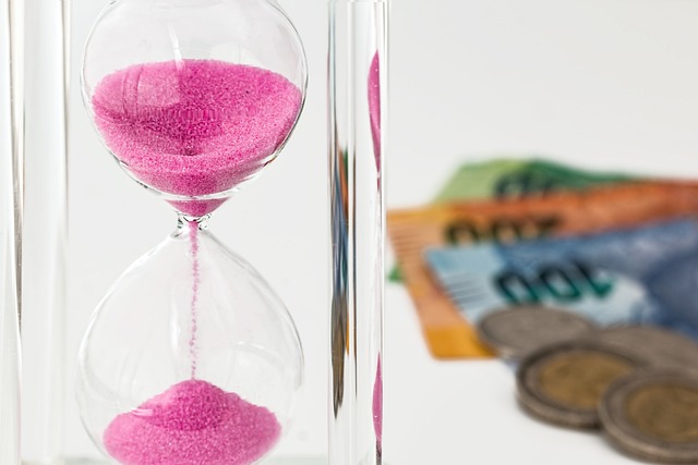 hourglass and money