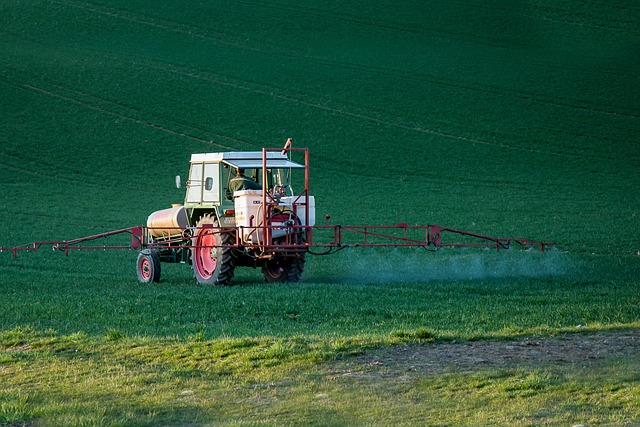 spraying crops with herbicide