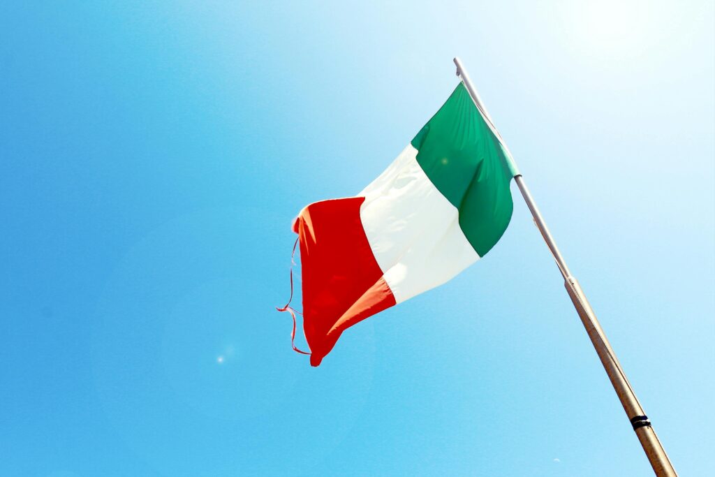 Low-angle Photography of Waving Red, White, and Green Flag
