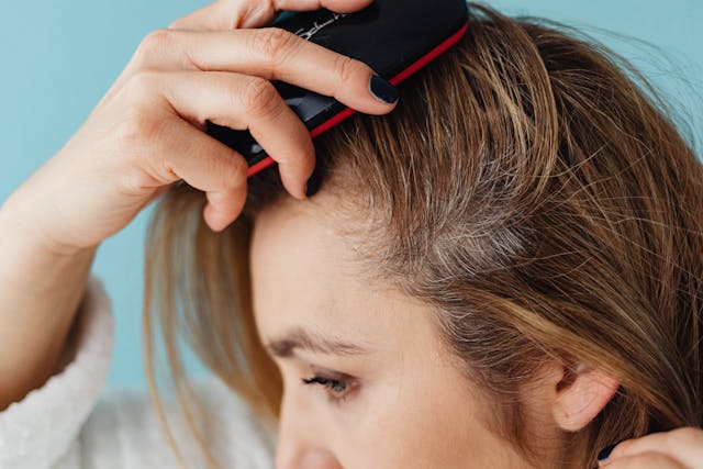 woman checking her hairline